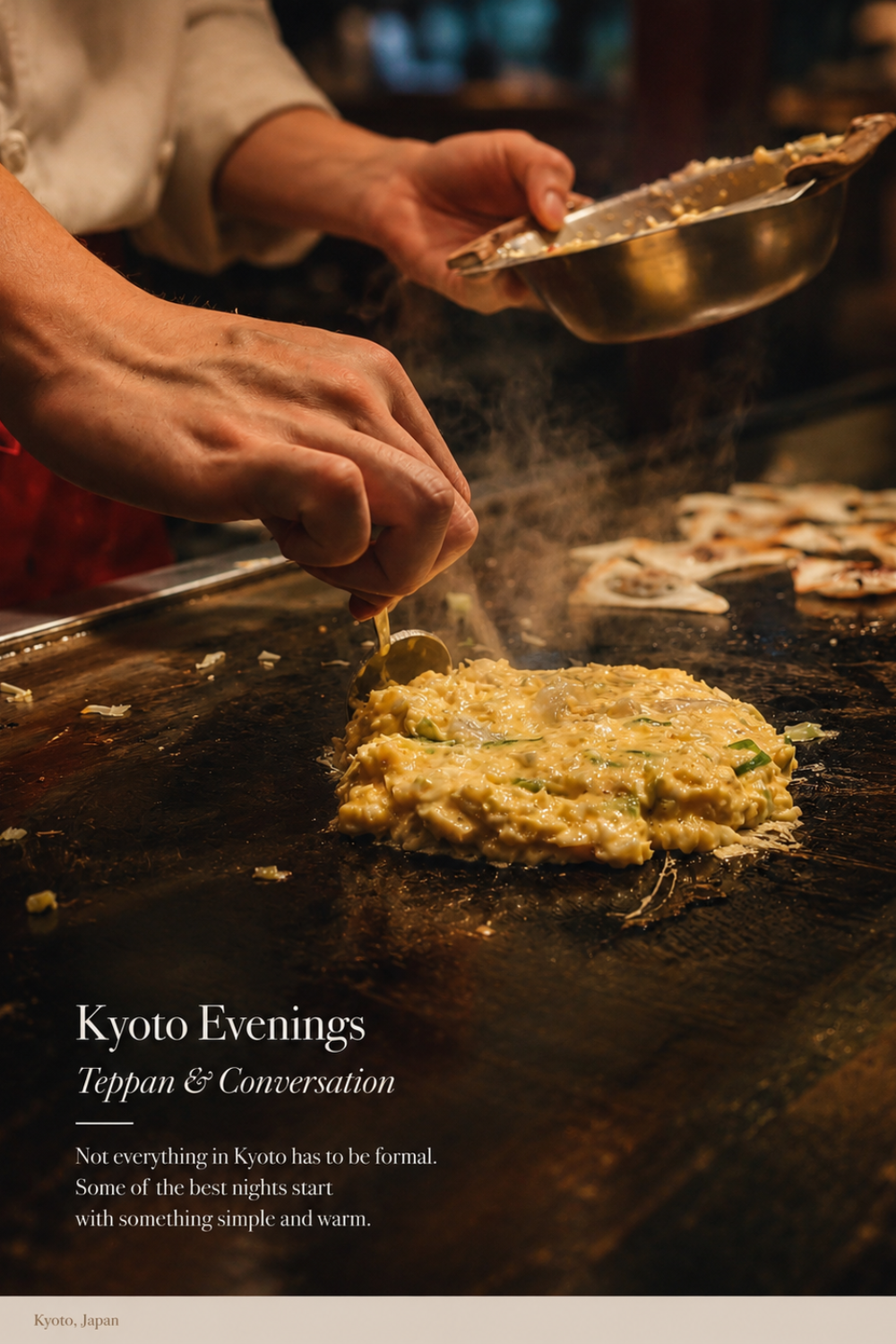 Okonomiyaki being cooked on teppan iron griddle Kyoto